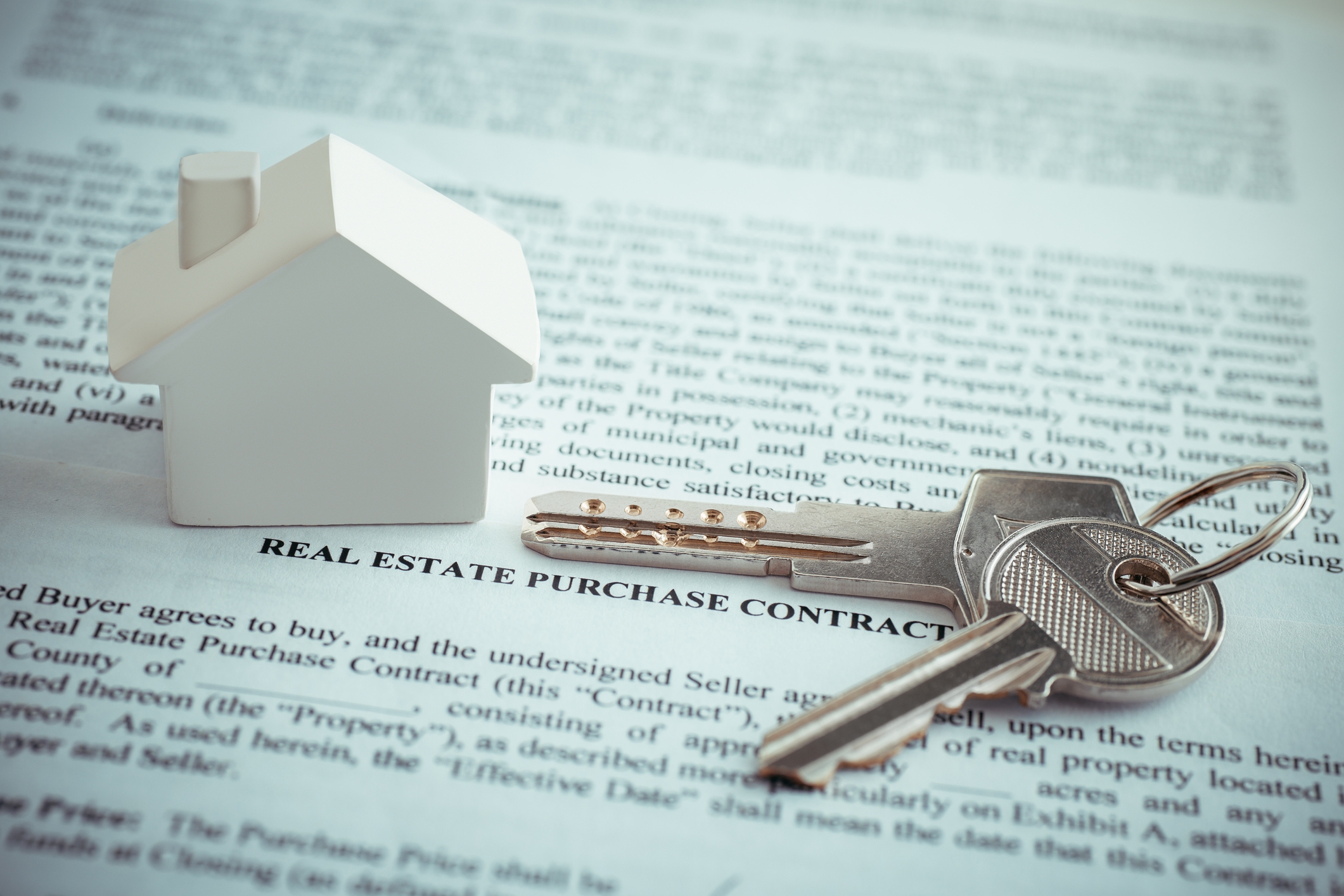 Real Estate Purchase Contract with a house key