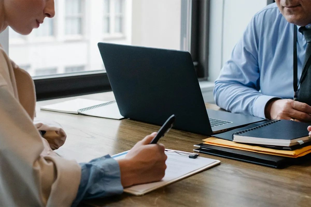 Q1 26 Article 1 Strategies to Manage Owners Corporation Disputes two professionals meeting